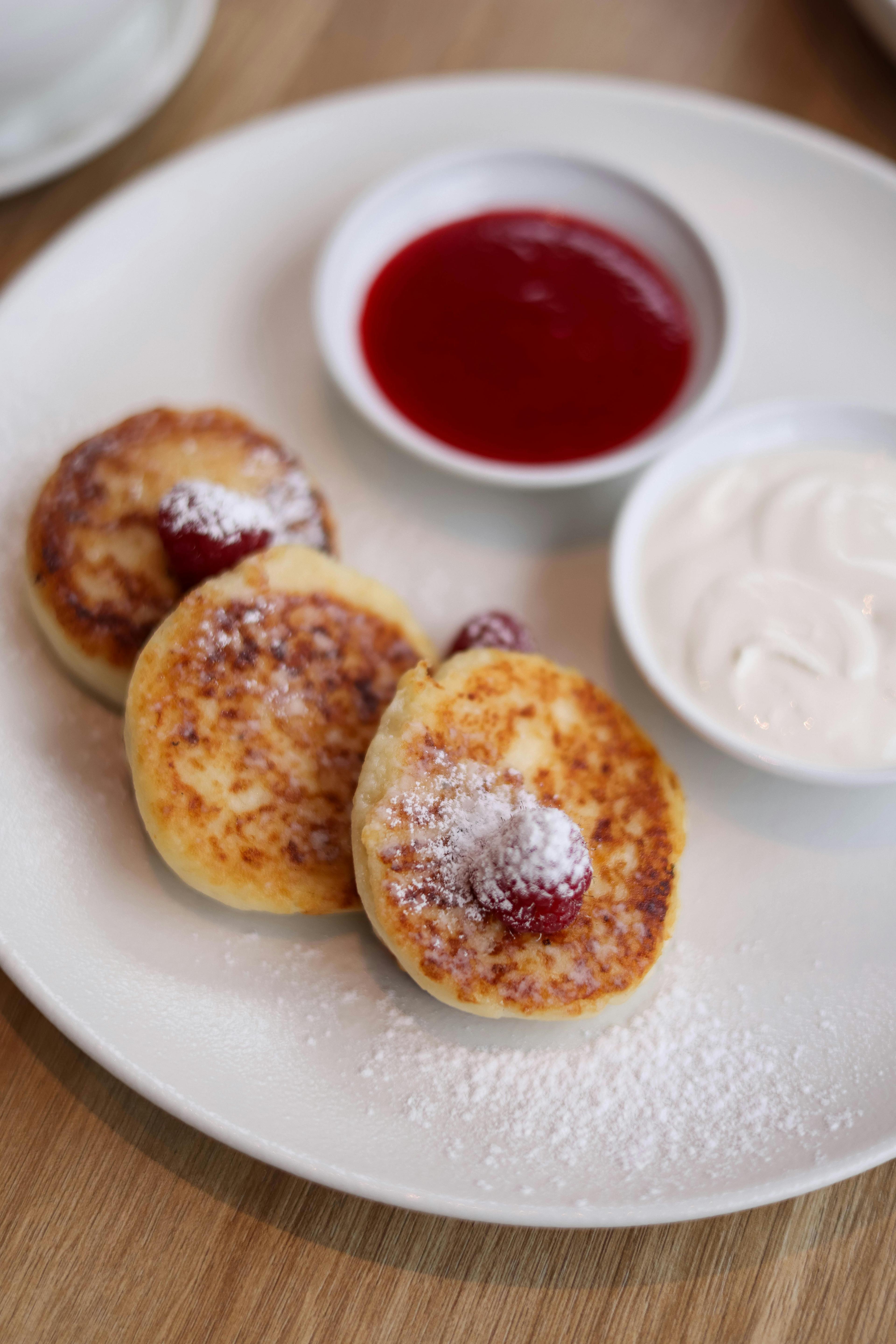 Syrniki (Ukrainian Cheese Pancakes) — fried recipe plated