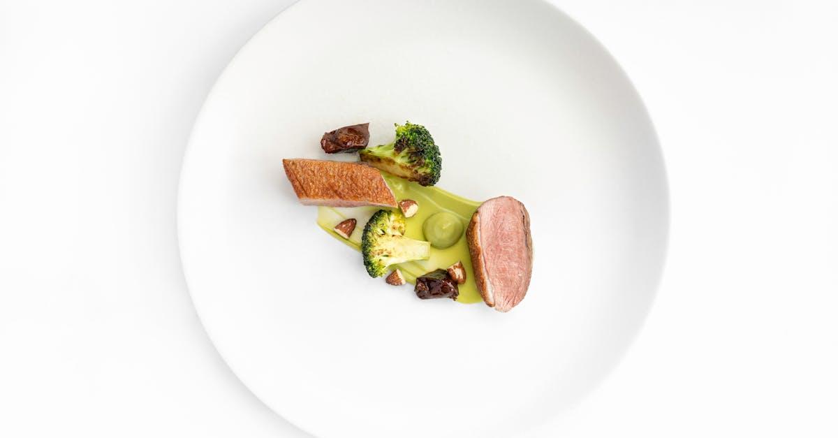 Braised Rabbit with Prosciutto and Broccoli Rabe — Plating & Composed Dishes recipe plated